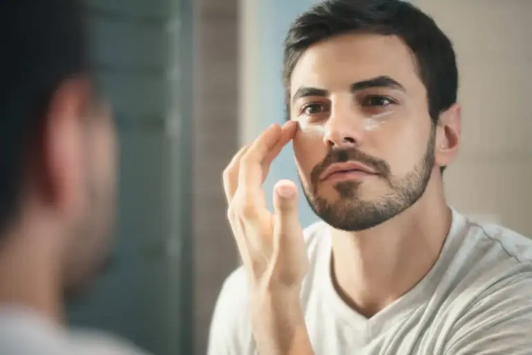 a men using a facial cosmetic product