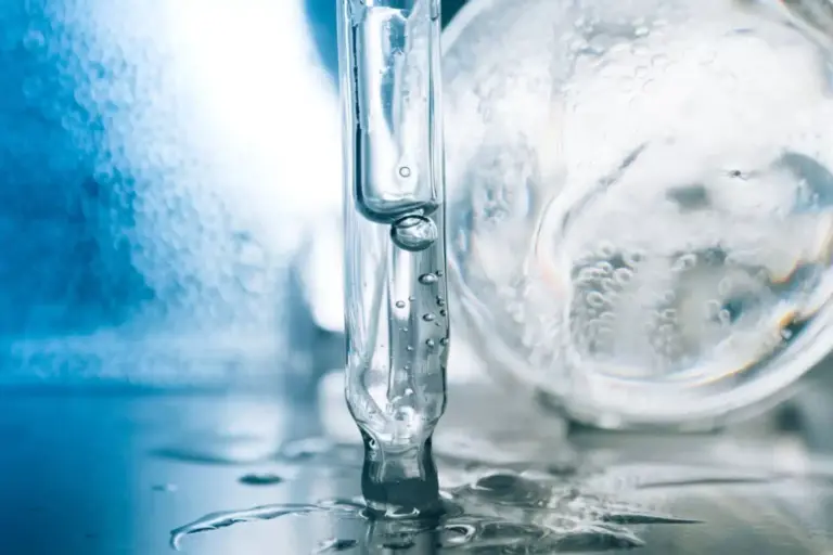 Hyaluronic serum drips from a pipette