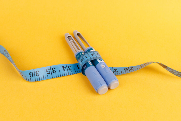 Measuring tape and Ozempic injection