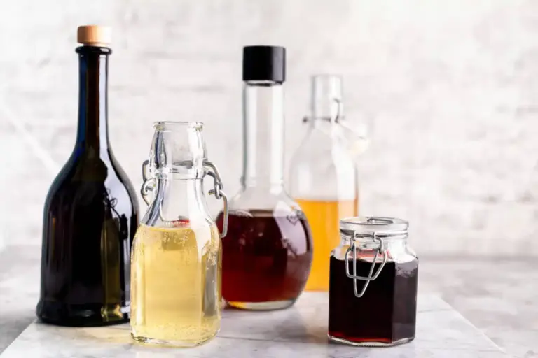 different types of vinegar in glass bottles